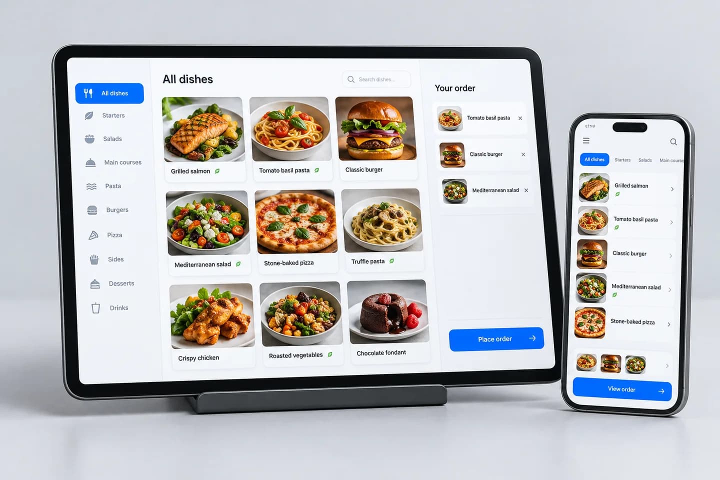 Restaurant ordering concept with a food menu on a tablet and a matching mobile ordering interface.